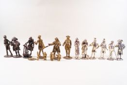 Twelve cast metal Dickens figures, patinated to simulate brass, chrome and bronze, 11cm and smaller,