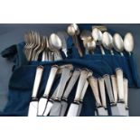 A Danish white metal extensive canteen of Danish flatware and cutlery for six plus,