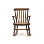 A 19th century child's and elm chair with turned back and solid seat