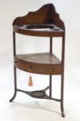 A George III mahogany bow fronted corner wash stand with one frieze drawer, overall 100cm high,