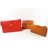 A vintage red leatherette handbag, embossed 'C de B', 39cm high (inc strap) x 39cm wide,