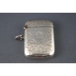 A silver vesta case with scrolling engraving,