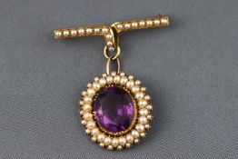 A Victorian yellow metal cluster pendant set with amethyst and seed pearls