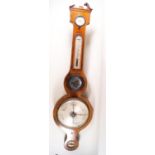 A George III banjo barometer with silvered dial in mahogany and boxwood strung case