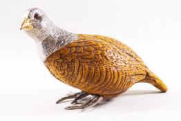 A composite figure of a partridge with silver plated mounts and glass eyes, signed,