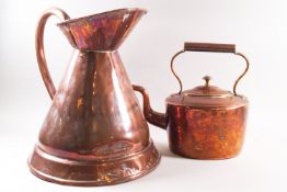 A Victorian copper kettle, 26cm high, and a copper jug with loop handle to the flared body,