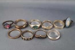 A selection of ten sterling silver dress rings; Size range: L to R