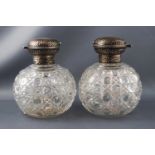 A pair of cut glass oversized scent bottles