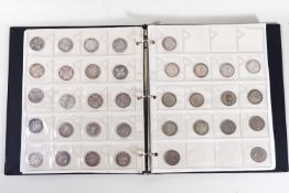 Two albums of coins and two associated boxes of similar