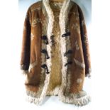 A 1960's Afghan sheepskin hippy coat with embroidered decoration.