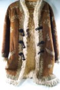 A 1960's Afghan sheepskin hippy coat with embroidered decoration.