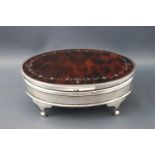 A silver and pique decorated tortoiseshell oval jewel casket, raised on four legs by Mappin & Webb,