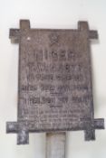 A cast metal marker for the grave of the dog T W 44877 "Niger", died 18th Jan 1932,