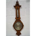 A Victorian carved oak wood Negretti & Zambra banjo barometer,