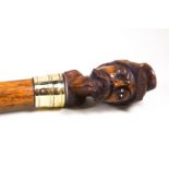 A walking stick, the knop carved with an American Civil War soldier's head,