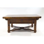 A continental elm coffee table, of rectangular form with the top linked by X stretchers,