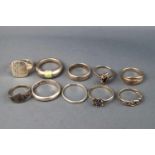 A collection of ten sterling silver rings consisting of plain bands, signet rings and some gem set.