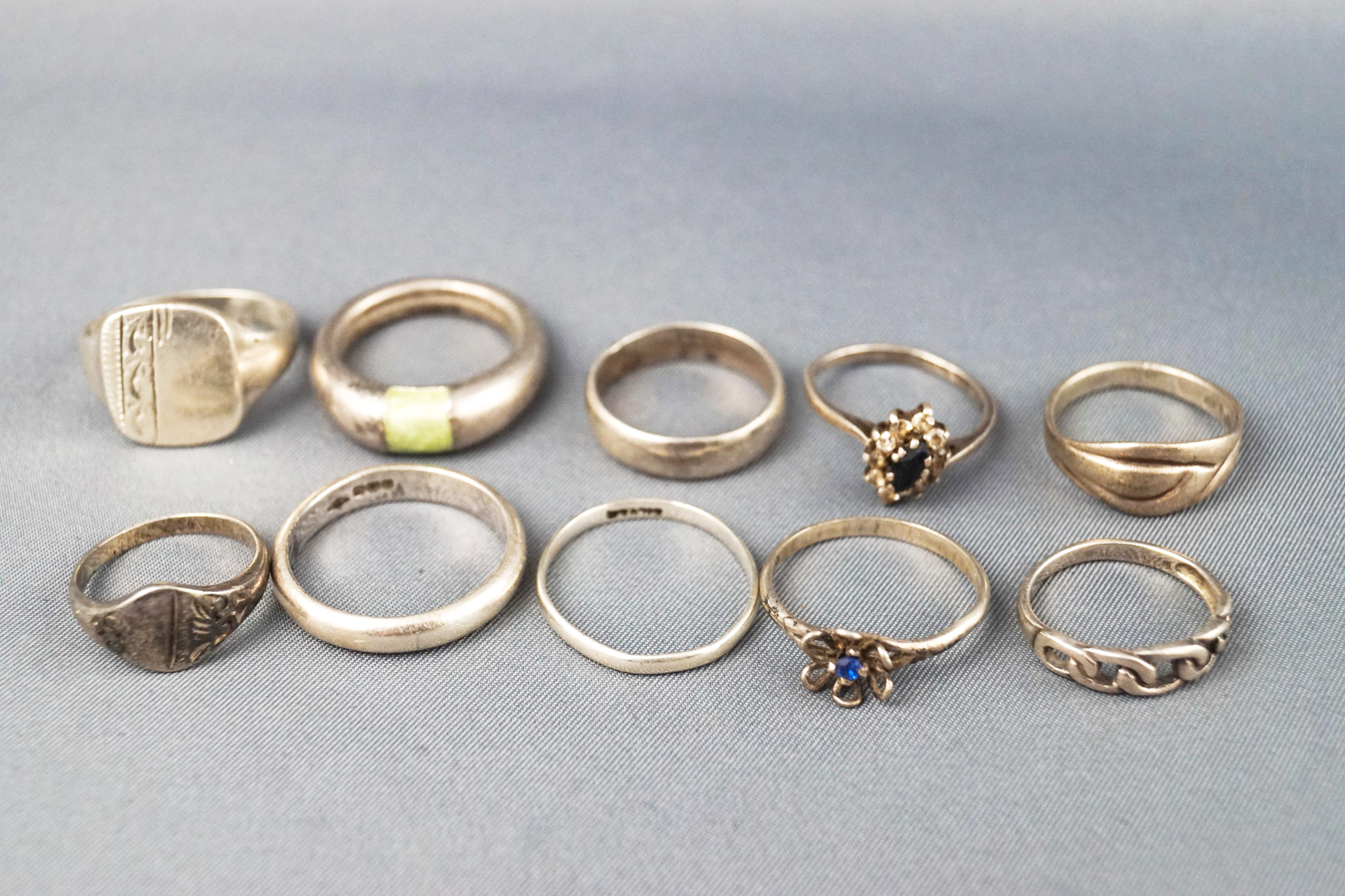 A collection of ten sterling silver rings consisting of plain bands, signet rings and some gem set. - Image 2 of 2