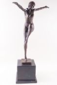 An Art Deco style bronze figure of a dancer on black slate base,