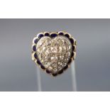A yellow metal heart shaped ring set with twenty four old brilliant cut diamonds