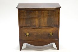 A George III mahogany commode, with bow front