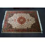 A red ground machine woven Keshan rug,