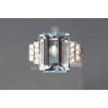 A white metal dress ring set with a rectangular faceted cut aquamarine approx 7.20 carats further
