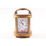 A 20th century carriage clock, of oval form, with enamel dial and side panels painted with Putti,