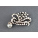 A white metal diamond spray brooch.