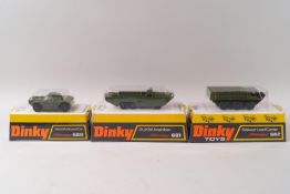 A Dinky DUKW amphibian No 681, a Stalwart load carrier No 682 and a Ferret armoured cat No 680,