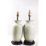 A pair of floral table lamps, 42cm high and a pair of celadon table lamps,