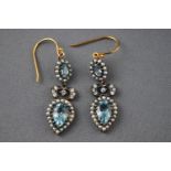 A pair of ornate drop earrings set with topaz, diamonds and pearls. Hook fitting.