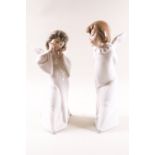 A pair of Lladro figures, Mime Angel and Curious Angel, printed factory marks,