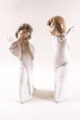 A pair of Lladro figures, Mime Angel and Curious Angel, printed factory marks,