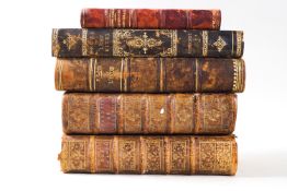A collection of leather bound books including "Les Saisons Poeme Traduit de Anglais De Thompson"