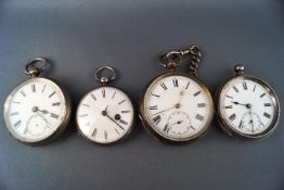 Four silver cased open face pocket watches and a winding key,