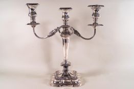 A loaded silver three branch candelabra of lobed floral decoration form, Sheffield 1963,