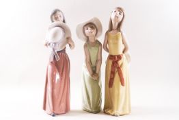 Three Lladro figures of ladies with hats, printed factory marks,