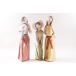 Three Lladro figures of ladies with hats, printed factory marks,