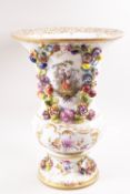 A late 19th century Continental porcelain Dresden style urn,