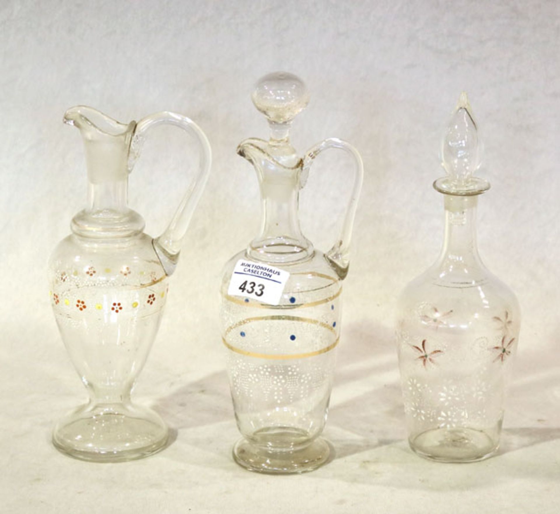 3 Glaskaraffen mit Bemalung, ein Stöpsel fehlt, einer nicht Original, H 22/25 cm, Gebrauchsspuren