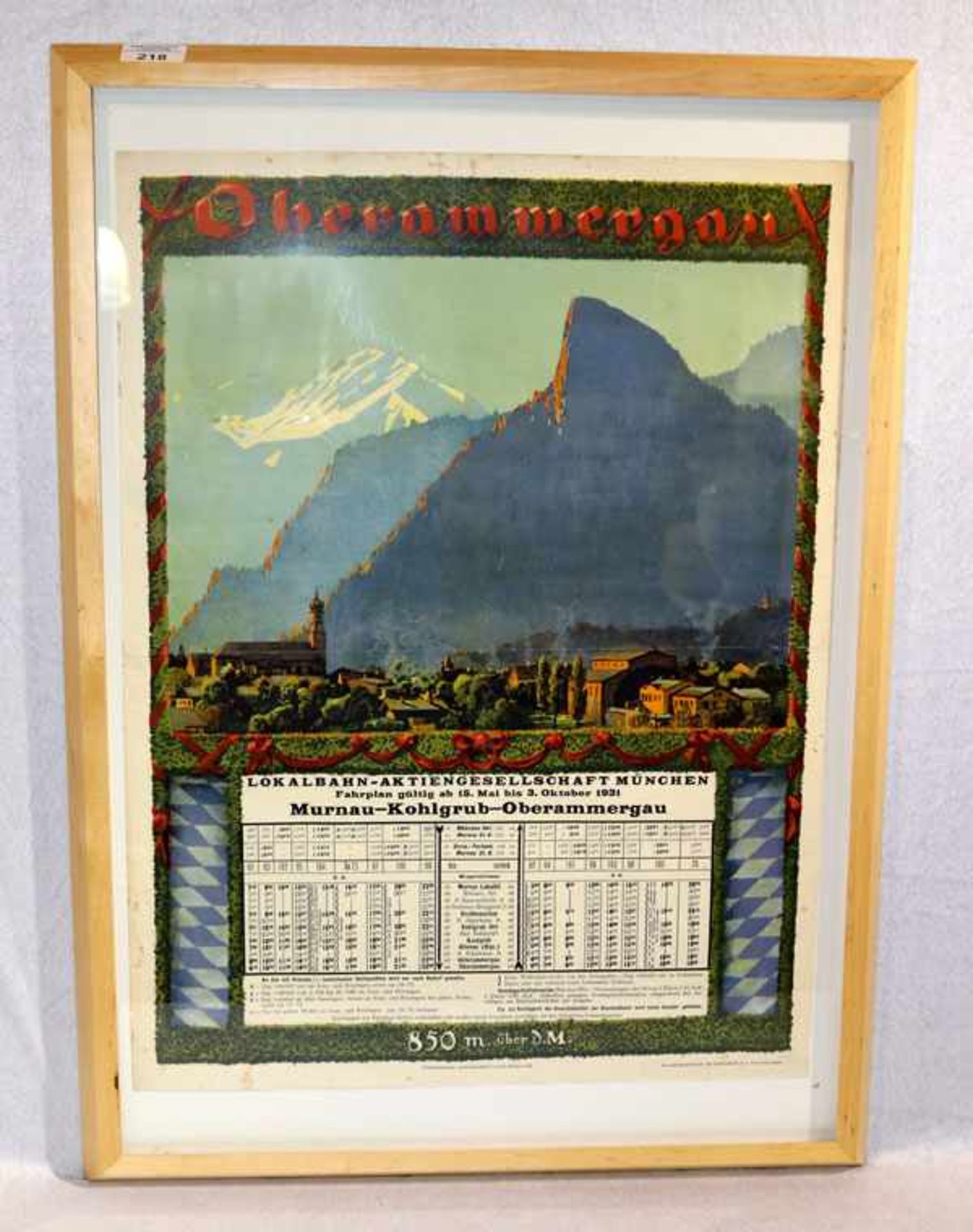 Plakat 'Oberammergau Lokalbahn Fahrplan Murnau-Kohlgrub-Oberammergau', teils fleckig, unter Glas