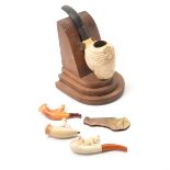 Four Meerschaum Pipes and a German Pin Knife in Form of Airplane