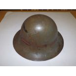 A WWII helmet – 'BMB 1941'.