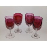 Four small Victorian cranberry wine glasses.