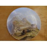 A Victorian cold-painted ceramic charger painted by Baring-Gould with a view of the Amphillsake of