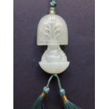 A Chinese jade concealed Buddha pendant, the flattened domed cover open carved with a flowering