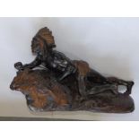 Varnier' – a parcel gilt & coloured bronze study of a North American Indian warrior crouching on a