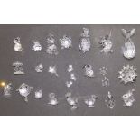 A collection of 25 boxed Swarovski glass animals. (25)