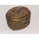 A 19thC French gilt & coppered metal oval jewellery casket decorated overall in high relief with